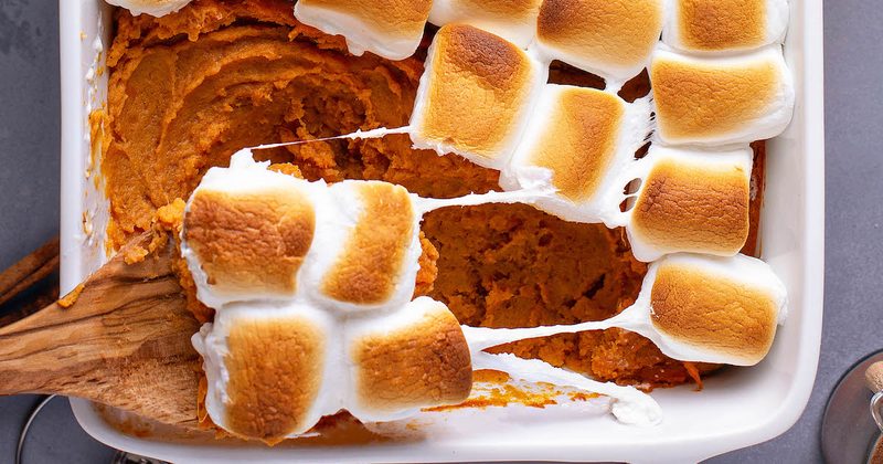Classic sweet potato casserole crowned with gooey toasted marshmallows, warm cinnamon, and brown sugar.