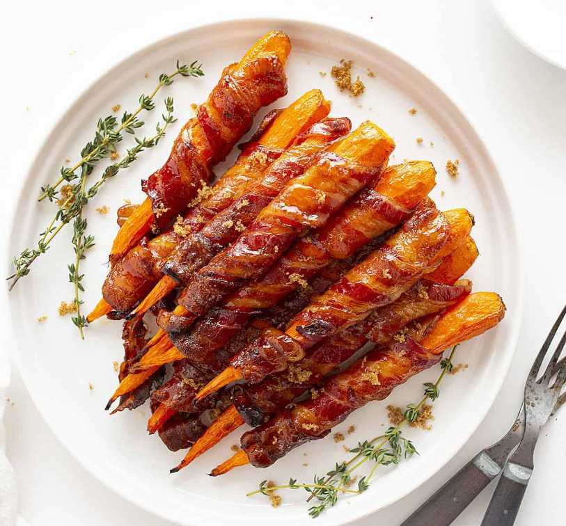 Sweet glazed carrots wrapped in crispy bacon, caramelized to a glossy finish