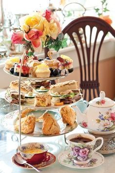Floral shortbread cookies and mini tarts on a vintage tier stand